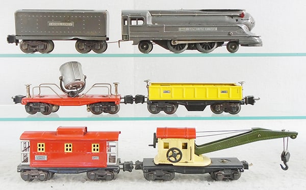 LIONEL TRAIN SET: O ga, 1688E die cast loco, 2689TX tender, 3652 operating dump car, 2620 searchlight, 2660 crane working, 2657 caboose, C5-6.