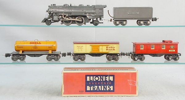 LIONEL TRAIN SET: O ga, 229 loco , orig box rough, 2689W tender, hole drilled in front of tender for wire, both are gunmetal, 1680 Shell tank, 2679 box car, 2682 caboose, oxidation spots, C5-6.