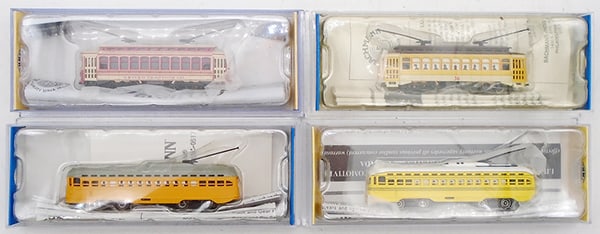 4 BACHMANN N SCALE TROLLIES: N ga, 62998 PCC trolley, 61098 Brill Trolley, yellow, 61087 Brill Trolley, 62991 PCC Trolley, all are powered w/lights, orig boxes, C9.