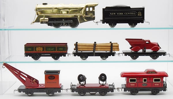 MARX TRAIN SET: O ga, 897 electric loco w/gold finish, 951 NYC tender, 552 gondola, 563 lumber car, 562 flat w/red truck, 550 NYC crane, 559 searchlight, 556 caboose, C6-8.