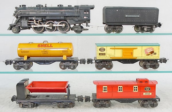 LIONEL TRAIN SET: O ga, 1666 die cast loco, 2689W tender, 2680 Shell tank, 2679 box car, 3659 dump car, 2682 caboose, C7-8.