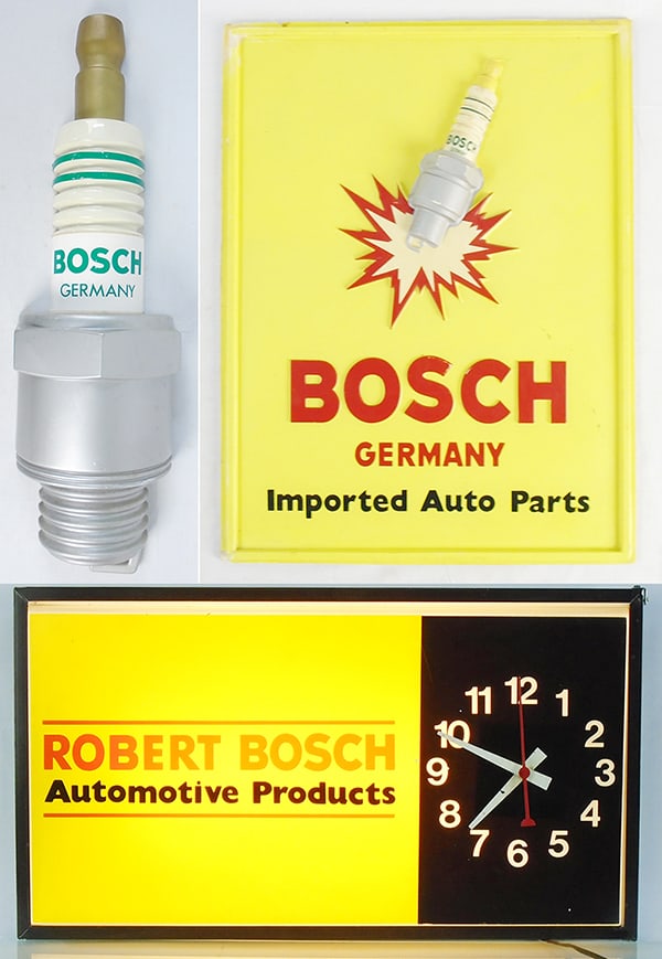 3 BOSCH SPARK PLUG ADVERTISMENTS: plastic large Spark Plug for wall mounting, 39 1/2" x 11", plastic Sign w/wood backing, 20" x 15 1/2", Robert Bosch Light-Up Clock, working, 25" x 14", C7-8.