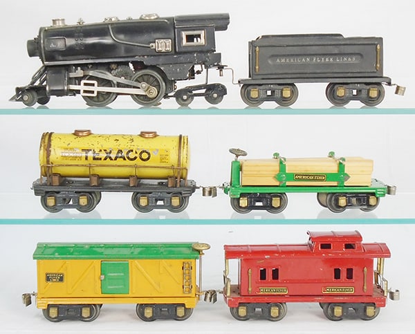 AMERICAN FLYER TRAIN SET: O ga, 401 loco, 421 tender, 231 Texaco tank, paint chips, 406 lumber flat, 229 box car, 232 caboose, minor decal wear, C5-7.