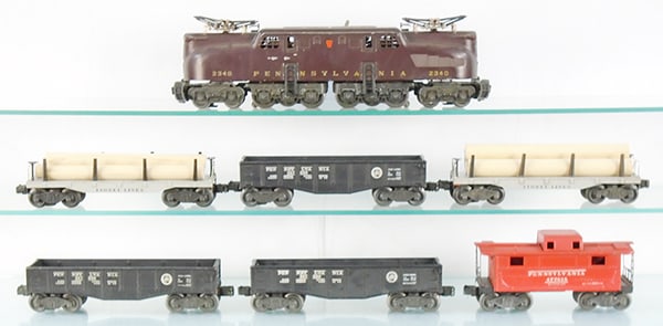 LIONEL TRAIN SET: O ga, 2340 GG1, tuscan, all rubberstamped stripes worn off, 2 #2411 lumber flats, 3 #2452X gondolas, 2472 caboose, C5-7.