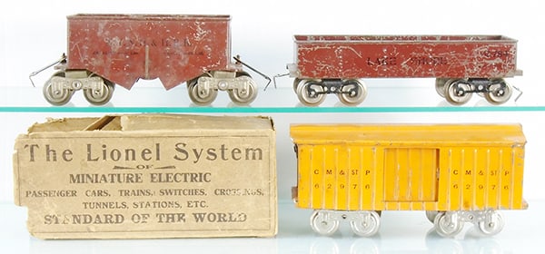 3 LIONEL FREIGHT CARS: std ga, 116 ballast, 112 gondola, embossed floor, 114 box car, embossed floor, w/some box remnants, C4-5.