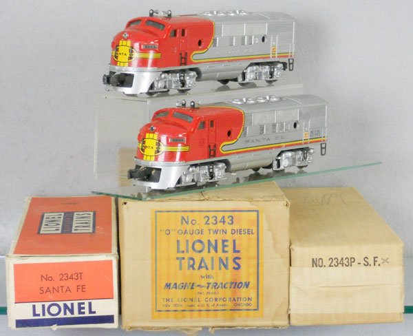 LIONEL 2343 SANTA FE DIESEL SET: O ga, 2343 AA diesels, front nose decal chip, screen tops, tender has some touch up spots, missing 7 porthole lenses, orig boxes & master carton minor wear, opened from bottom, C5-6.
