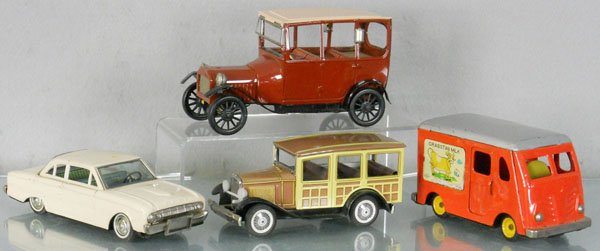 BANDAI & CRAGSTAN AUTOS: litho tin, friction working, Bandai Ford Falcon, 8 3/4" long, Model A Woody Wagon, 7" long, Ford Model T, 7 " long, Cragstan Milk Truck, some surface oxidation, 6 3/4" long, C5-7.