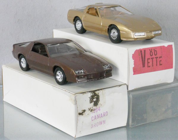 2 MPC CHEVY PROMOS: plastic, 1984 Camaro, brown, 1986 Corvette, gold, orig boxes minor wear, C9.