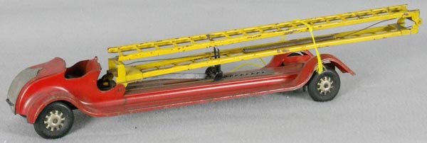 KINGSBURY LADDER FIRE TRUCK: painted pressed steel, 23" long, windup working, missing driver, C5.