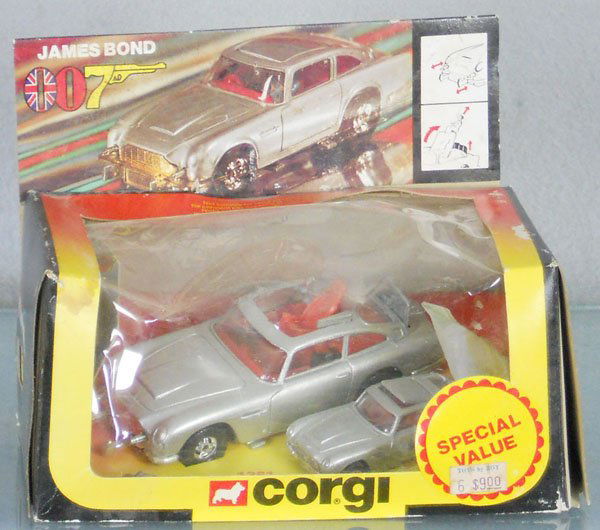 CORGI 1361 JAMES BOND ASTON MARTIN SET: w/sealed packet, orig box rough & dirty, C8-9.