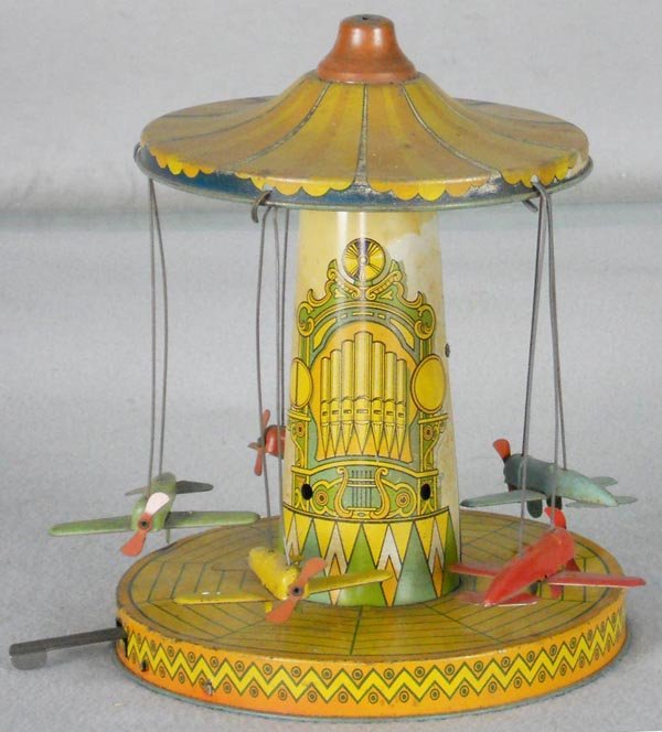 AIRPLANE CAROUSEL: litho tin, windup working, some fading, 10" tall, C5-6.
