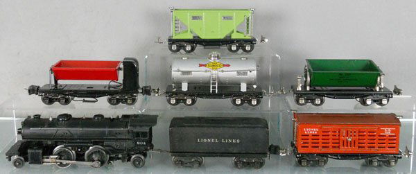 LIONEL TRAIN SET: O ga, 204 loco, 2689W tender, some oxidation spots, 656 stock car, 3659 dump car, 654 Sunoco tank, 3659 dump car, 653 hopper, C4-6.