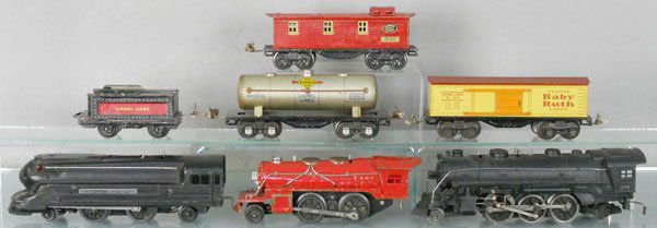 LIONEL TRAIN LOT: O ga, 1688 loco, 166 loco, cowcatcher step broken, 1681 loco, 1681T tender, 1680 tank, 1679 box car, 1682 caboose, C4-5.