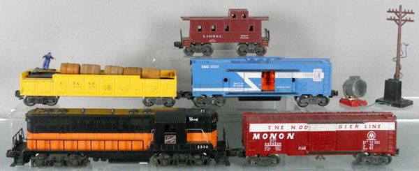 LIONEL TRAIN SET: O ga, 2338 Milwaukee GP7, box rubs on fans, 3494 operating Monon box car, 3562-50 barrel car, 3530 electro mobile power car w/pole & searchlight, 6017 caboose, C5-7.