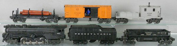 LIONEL TRAIN SET: O ga, 681 turbine loco, touch up on cowcatcher, 2671WX tender, 3489 auto dump, 3461 log dump, 3464 AT&SF operating box car, 6419 work caboose, C5-6.