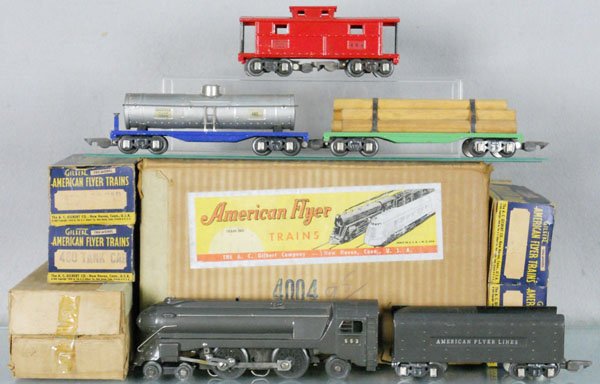 AMERICAN FLYER 4004 TRAIN SET: O ga, 553 loco, pony wheels fatiguing, 552 tender, 480 tank, 482 log car, 484 caboose, w/track, orig boxes have loose flaps & some wear, orig set box minor wear, C6-7.