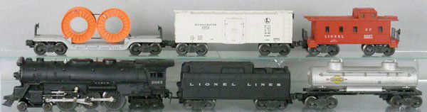 LIONEL TRAIN SET: O ga, 2065 loco, missing 1 handrail, 1 cowcatcher step bent, 6026W tender, 6465 Sunoco tank, 6561 flat w/cable reels, 6472 milk car, 6257 caboose, orig boxes rough, C5-7.