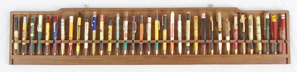 36 ADVERTISING PENS: in wood display rack, 36" long, mostly automotive, C7-8.