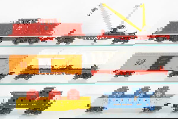 LIONEL TRAIN SET: O ga, 627 LV hopper, 6660 boom car, 6464-725 New Haven box car, 6430 van car, 6162-60 Alaska gondola w/canisters, 6027 Alaska caboose, C7-8.