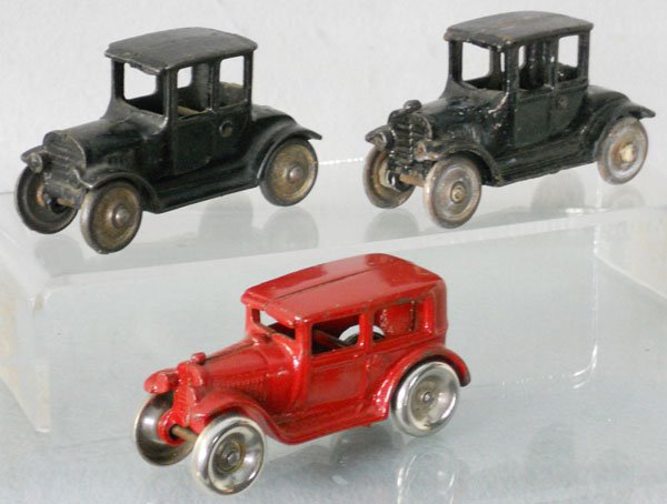 3 CAST IRON AUTOS: painted cast iron, 2 Hubley Model T's, 4" long, 1 has a broken radiator cap, Arcade Sedan, C5-6.