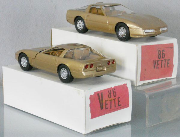 2 MPC 1986 CORVETTE PROMOS: plastic, gold, 1 has small casting flaw on rear bumper, orig boxes minor wear, C9.