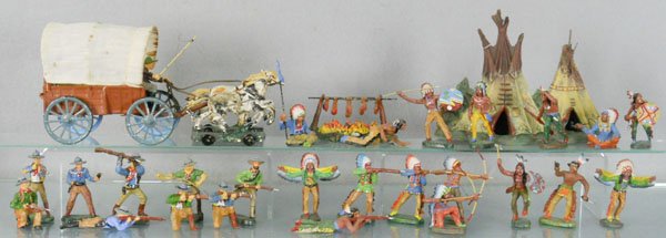 ELASTOLIN COWBOYS & INDIANS: 28 pieces, some cracking, wagon has canopy stains, horse head broken, teepee has cracks at top, C4-8.