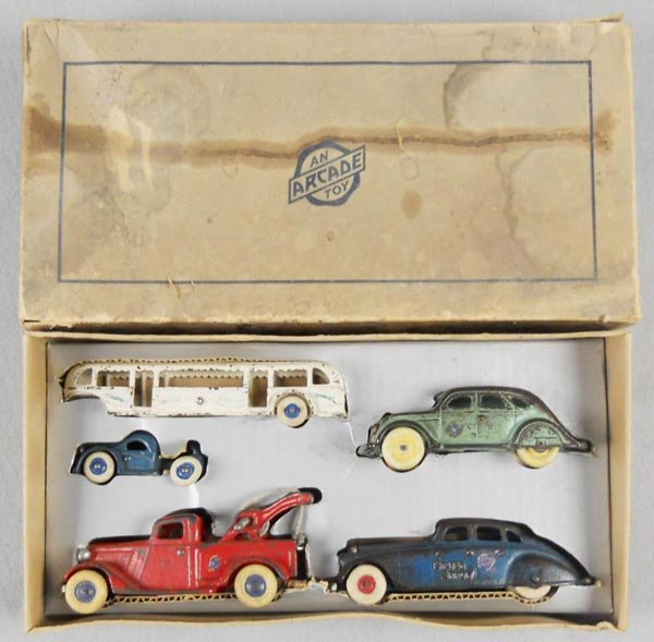 ARCADE 3520 ASSORTMENT SET: painted cast iron, Century of Progress 1934 Bus, 10" long, Airflow, 6" long, Wrecker, 6 1/2" long, Silver Arrow, 7" long, orig box worn, w/nicely done homemade cardboard insert, C4-5.