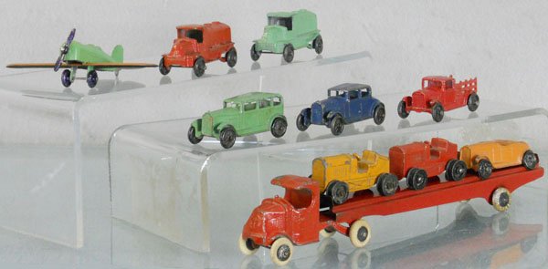 TOOTSIETOY VEHICLES: 190 Mack Auto Transport, 102 Airplane, 2 Tractors, missing treads, 2 Mack Oil Trucks, 109 Stake Truck, C4-6.