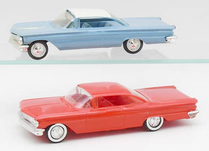 2 AMT 1960 PONTIAC BONNEVILLES: the ivory & blue is friction working, the red is a coaster, C7-8.