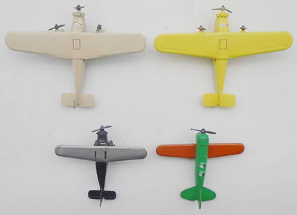 4 TOOTSIETOY AIRPLANES: 2 #4649 Ford Tri-Motors, cream is orig, yellow is restored, 107 High-Wing, silver & black, 106 Low Wing, green & orange, all propellers intact, C6-9.