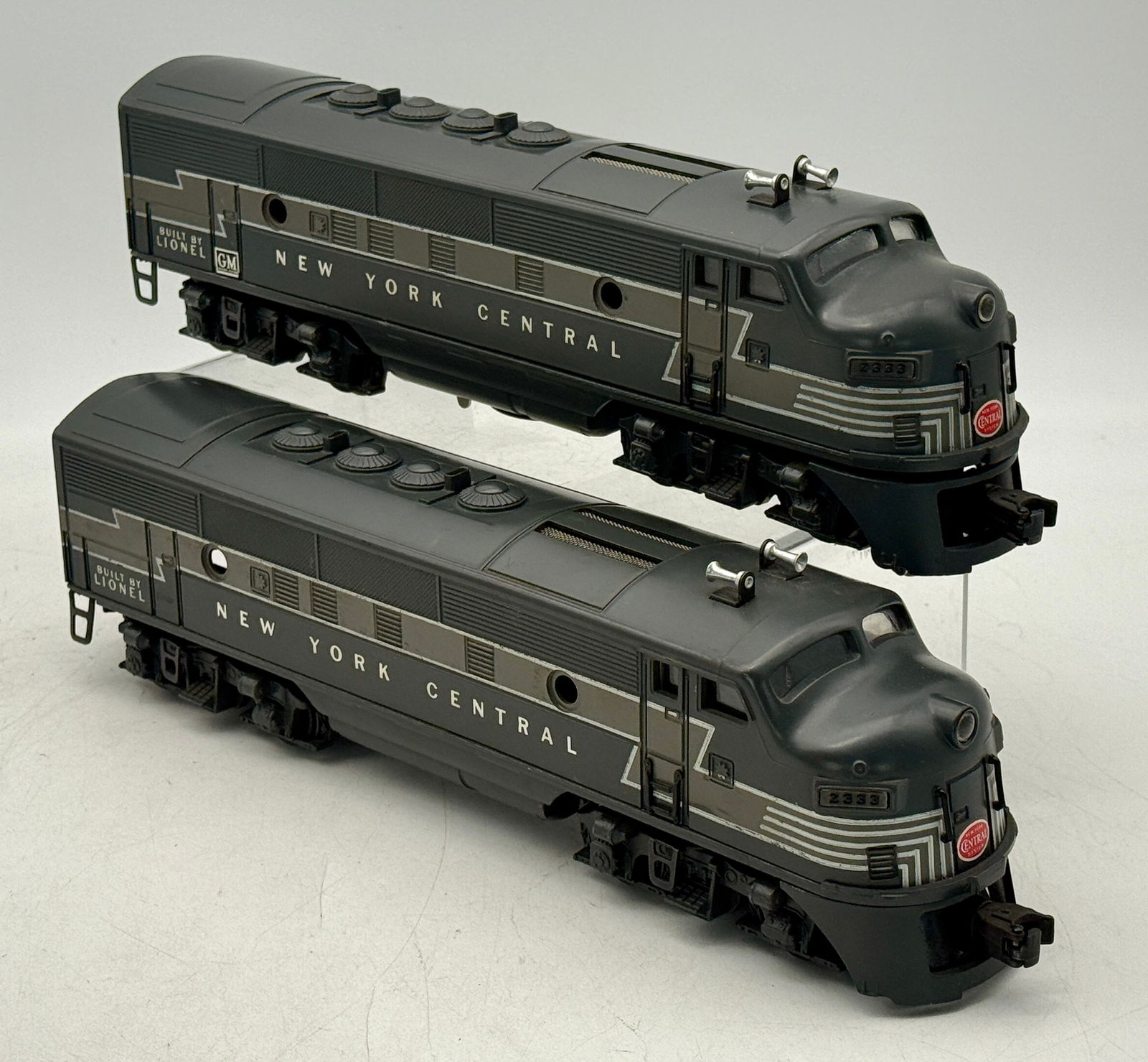 A Pair of Postwar Lionel New York Central F3 AA Diesel Locomotives, No. 2333: A pair of postwar Lionel New York Central F3 AA diesel locomotives, comprising one powered unit (2333P) and one trailer unit (2333T), both numbered 2333. Each O-gauge model is styled as an F-unit and