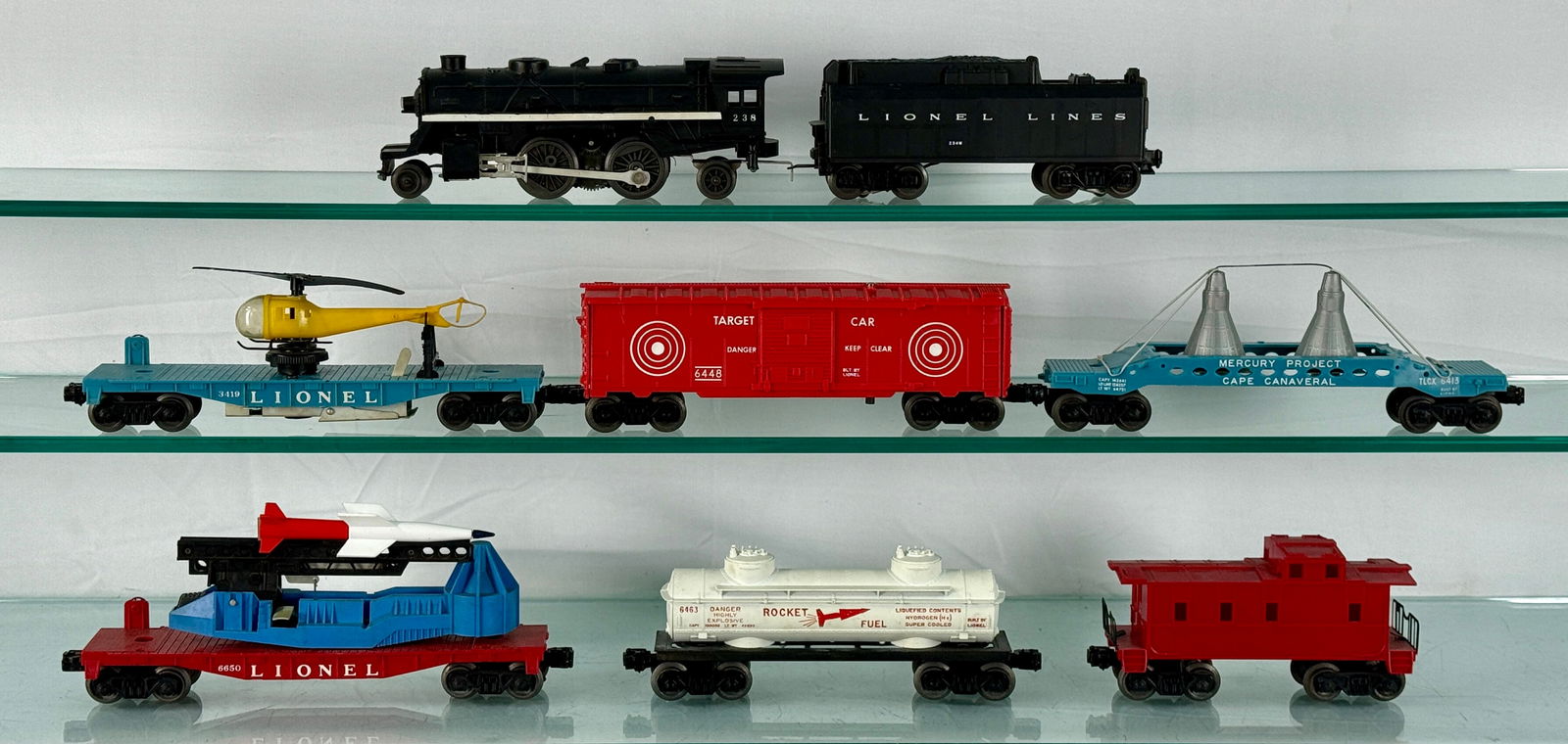 Lionel Lines Allied Store Set No. 19241: O Gauge No. 19241 Allied Stores Promotional set from 1963. The set includes a black steam-style locomotive 238 with tender 234w, 6463 Rocket Fuel, 6413 Mercury Capsule transport, 6650 Missle Firing Ca