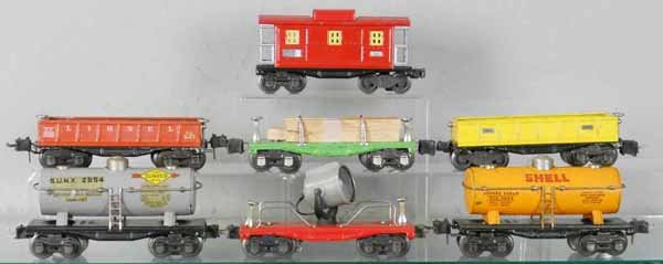 7 LIONEL FREIGHT CARS: O ga, 2654 Sunoco tank, decals yellowed, 2651 lumber, 2652 gondola, missing brakewheel, 1 truck incorrect, 2620 searchlight, 2652 gondola, 2654 Shell tank, decals have chips, 2657 caboose, 1 truck inc
