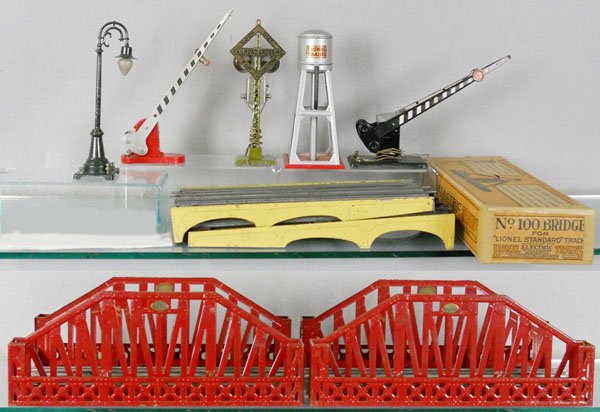 8 LIONEL ACCESSORIES: std ga, 59 lamp post, 152 crossing gate, 69 signal, 93 water tower, 77 crossing gate, 100 bridge approaches, w/worn orig box, 2 #280 bridges, C5-6.