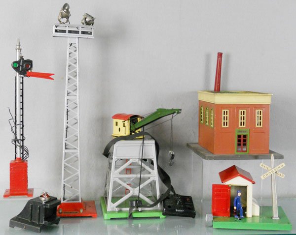 6 LIONEL ACCESSORIES: O ga, 82 semaphore, 25 bumper, die cast fatiguing, 92 floodlight tower, 165 crane, 135 power station, 45N gateman, C5-6.