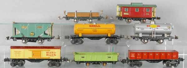 8 LIONEL FREIGHT CARS: O ga, 831 lumber, 2657 gondola, 902 gondola, 2679 Baby Ruth, 2680 Shell tank, 803 hopper, 804 Sunoco tank, solder repair on handrail, 807 caboose, C5.
