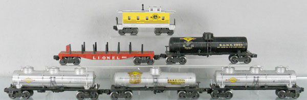 6 LIONEL FREIGHT CARS: O ga, 6557 caboose, 6511 flat car, 2855 tank car, 2555 tank, decals yellowing, 2 #6415 tank cars, C4-5.
