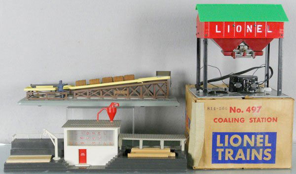 3 LIONEL ACCESSORIES: O ga, 464 saw mill, 497 coaling station, 1 roof tab broken, orig box minor wear, 362 barrel loader, 2 small melt marks, C5-6.