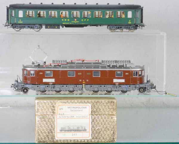METROPOLITAN SWISS TRAIN SET: HO ga, 2-rail, 675 loco, brass, missing 5 handrails, w/plastic Swiss 3-rail coach, lighted interior, orig boxes, C8.