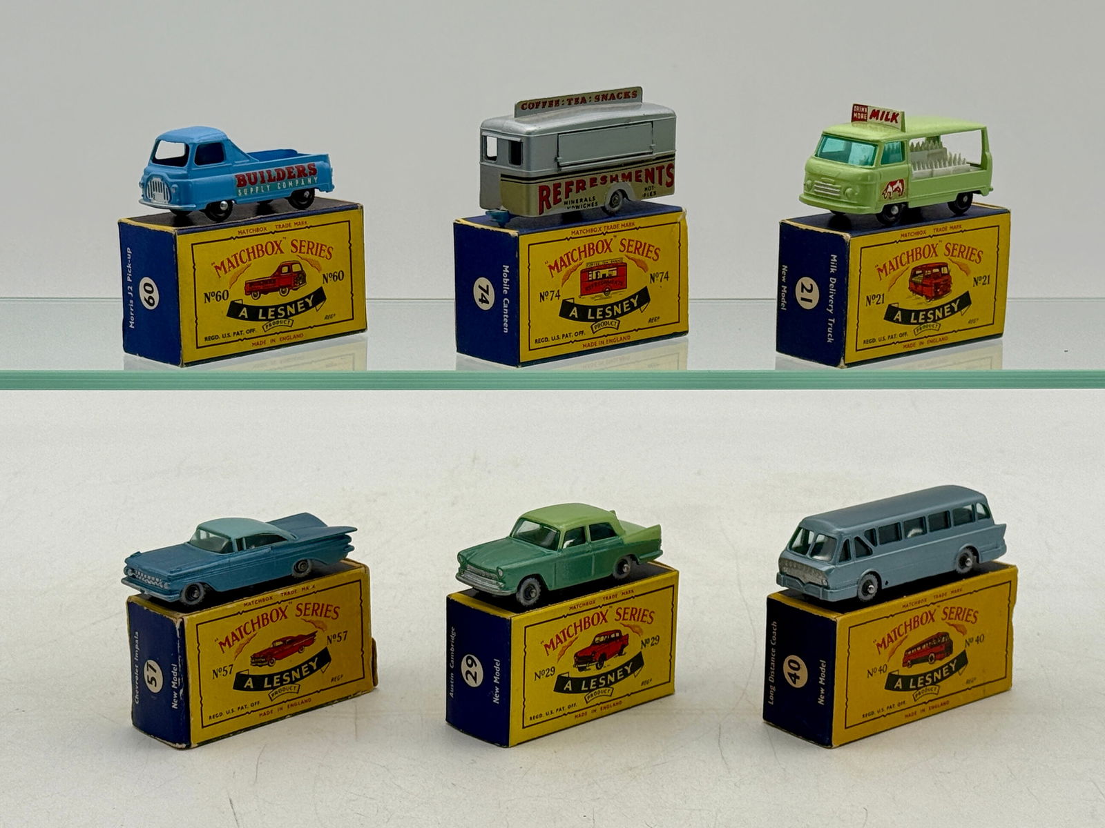 Six Matchbox Vehicles: 21C8 Commer Milk Float, 29B2 Austin Cambridge, 40B2 Leyland coach, 57B3 Chevrolet Impala, 60A5 Morris Pickup, 74A8 Mobile Canteen, C boxes are incomplete C 7â€“9.