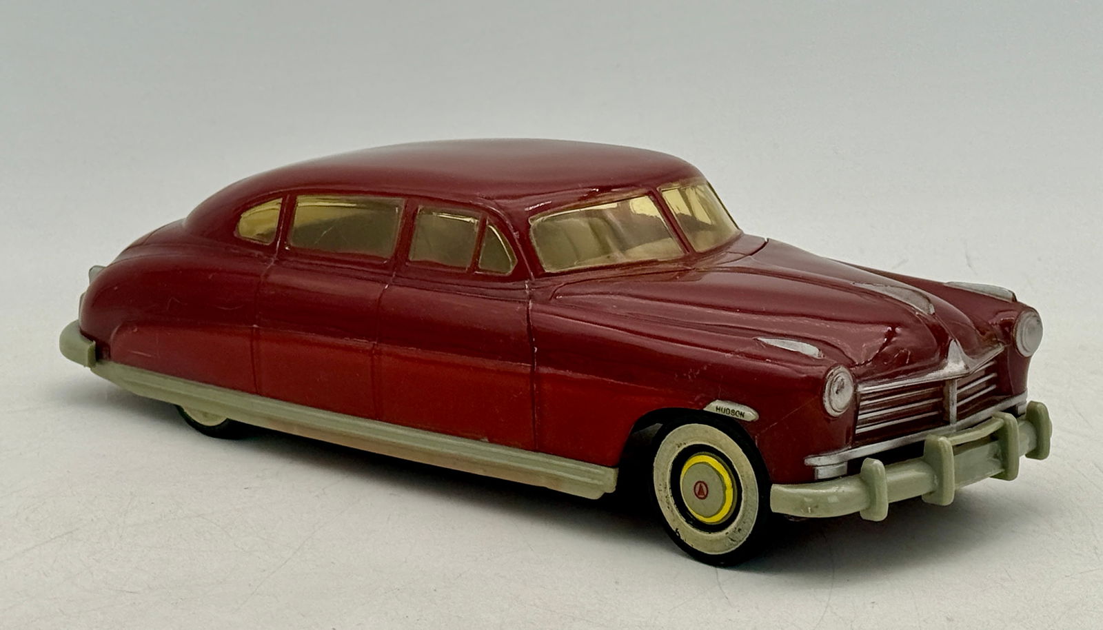 1948-49 Hudson Commodore Promo Automobile: Plastic two tone red 13 inches with added yellow trim ring on front tires C7-8.