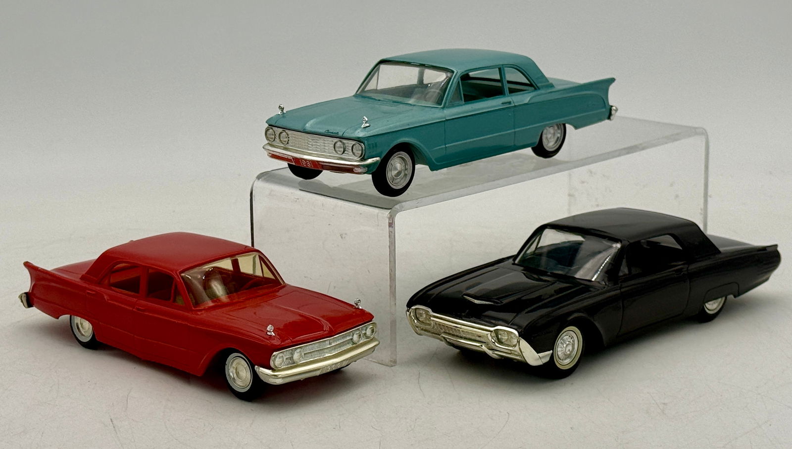 Three AMT Promo Model Cars: 1961 Ford Thunderbird black friction working, 1960 and 1961 Mercury Comets both are coasters C7-8.