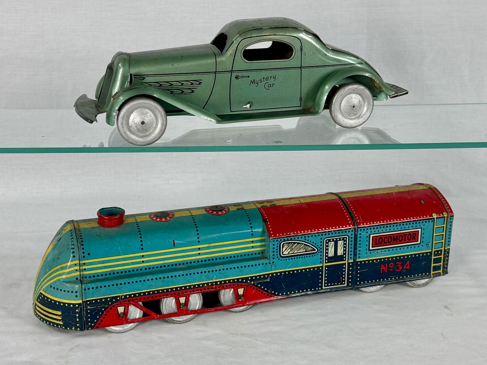 A Pair of Wolverine 'Mystery Car' and 'LOCOMOTOR' Tin Toys (1 of 2)