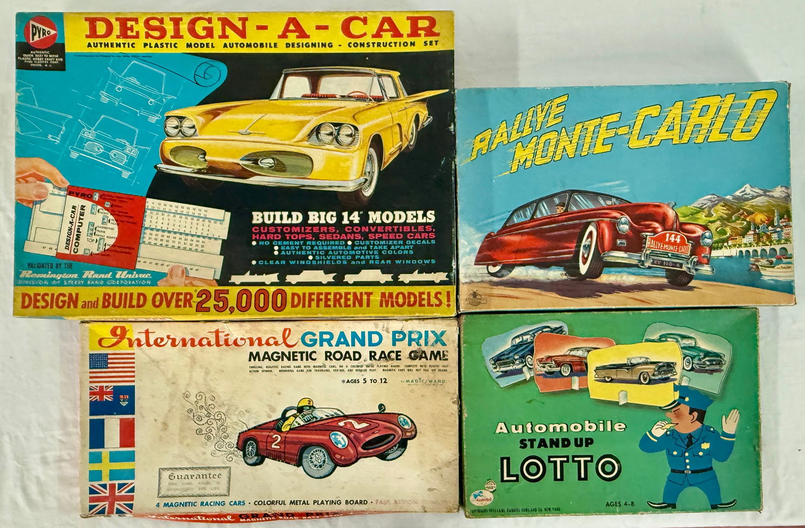A Group of Four Vintage Car-Themed Games: A group of four vintage car-themed board games and construction sets, including a PYRO 'DESIGN-A-CAR' model kit, a 'RALLYE MONTE-CARLO' game, an 'International GRAND PRIX MAGNETIC ROAD RACE GAME' by *