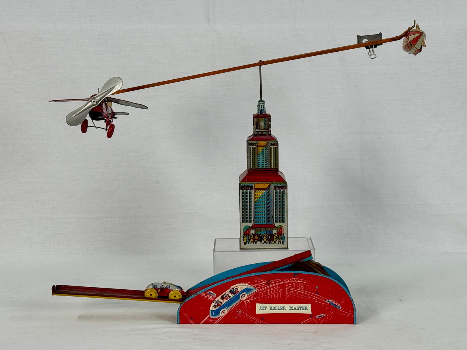 Two Marx/Wolverine toys: Litho tin Wolverine Jet Roller Coaster 20 inches long working Marx Sky Flyer 13 inches tall working C6-7.