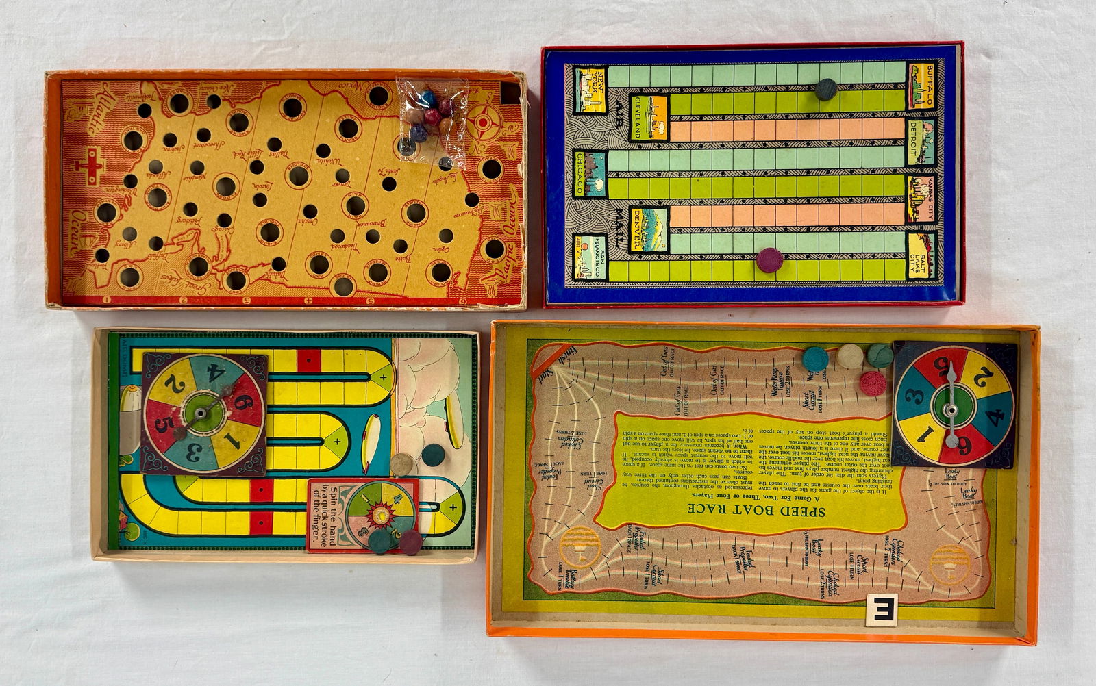 Four Milton Bradley games: Speedboat race, Air mail, Above the clouds, Air mail, all of appear complete original boxes, minor wear C8.