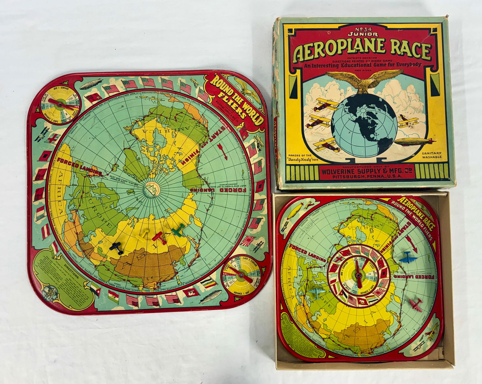 Collection of Vintage Wolverine Round The World Fliers Tin Games:  A large, red, yellow, green, and blue "ROUND THE WORLD FLIERS" game, and a smaller, similarly colored "AEROPLANE RACE ROUND THE WORLD FLIERS" board contained within its "NÂ? 34 JUNIOR AEROPLANE