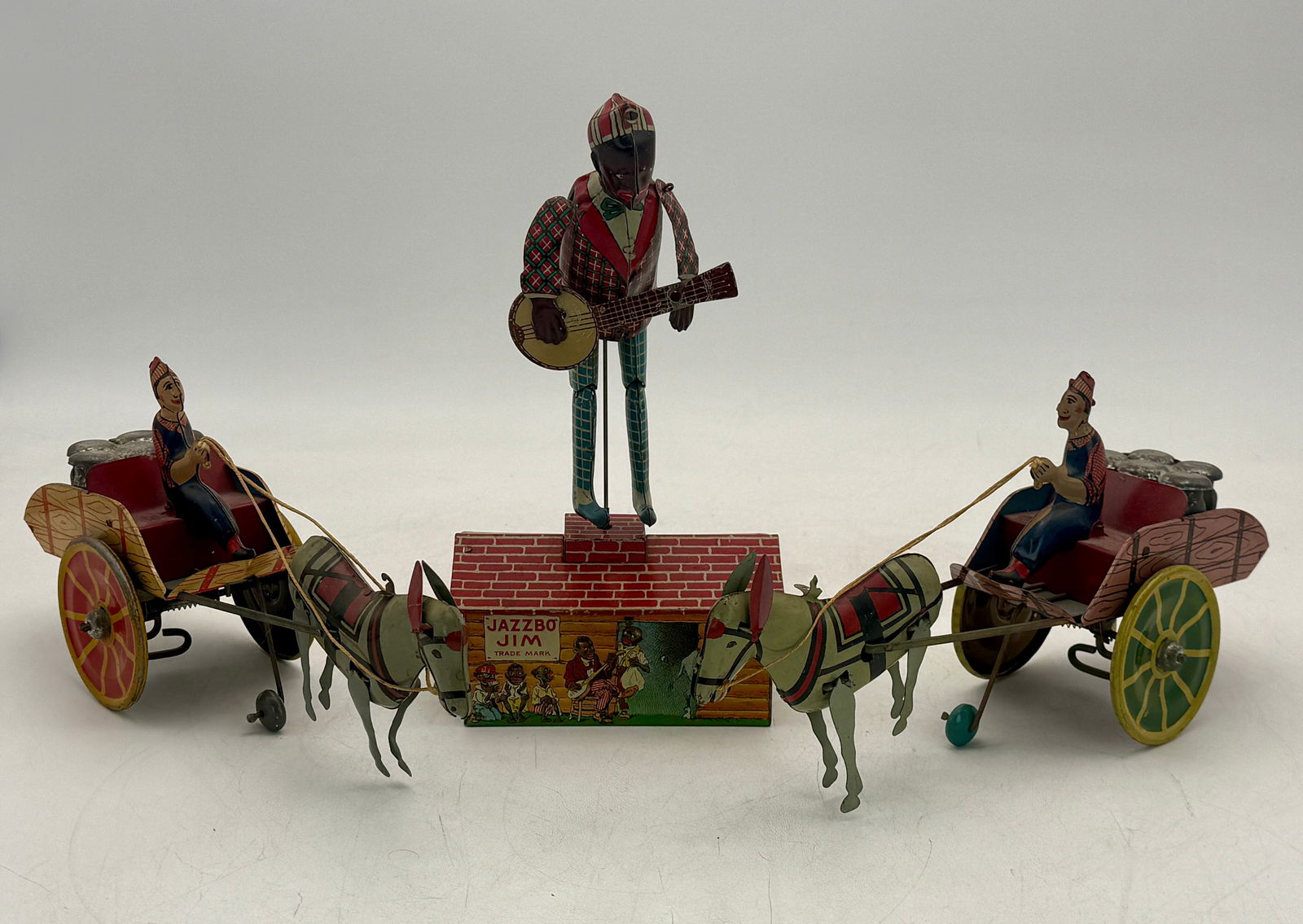 Three Tinplate Strauss Wind-Up Jazzbo Jim and Horse-Drawn Cart Toys (1 of 2)