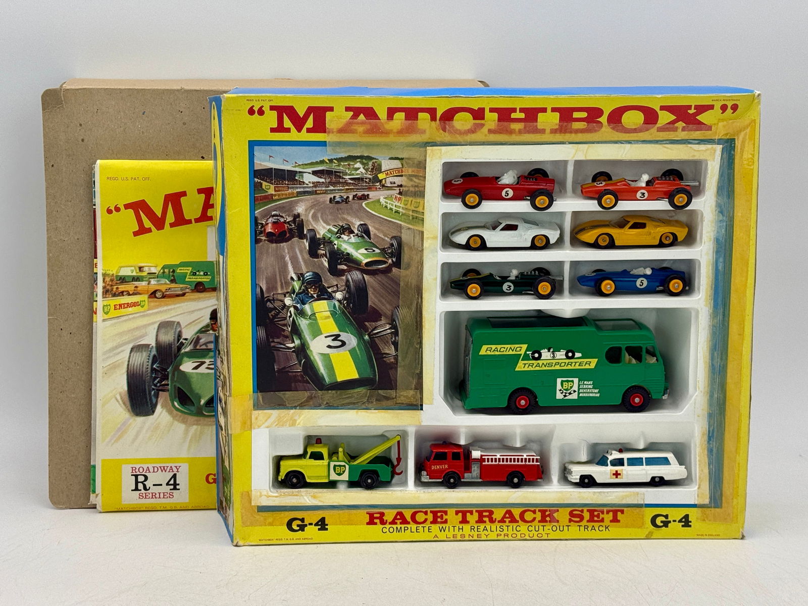 Matchbox G-4 Race Track Set: A Matchbox G-4 Race Track Set, a Lesney Product, in yellow display and Roadway R-4 Series packaging, includes 52B4, 19D1, 41C2, 41C4, 19D3, 52B5, K5, 13D3, 29C1, 54B1 original box missing plastic wind