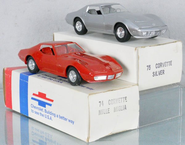 2 MPC CORVETTE PROMOS: plastic, 1975 silver, 1974 dark red, orig boxes minor wear, C9.